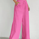 Pantalones sueltos de pierna ancha de color solido para mujer con dobladillo fluido, estilo casual