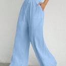 Pantalones sueltos de pierna ancha de color solido para mujer con dobladillo fluido, estilo casual