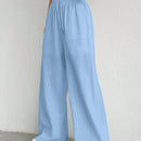 Pantalones sueltos de pierna ancha de color solido para mujer con dobladillo fluido, estilo casual