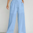 Pantalones sueltos de pierna ancha de color solido para mujer con dobladillo fluido, estilo casual