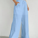 Pantalones sueltos de pierna ancha de color solido para mujer con dobladillo fluido, estilo casual