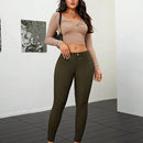 Pantalones ajustados de talle alto y cremallera para mujer de color liso
