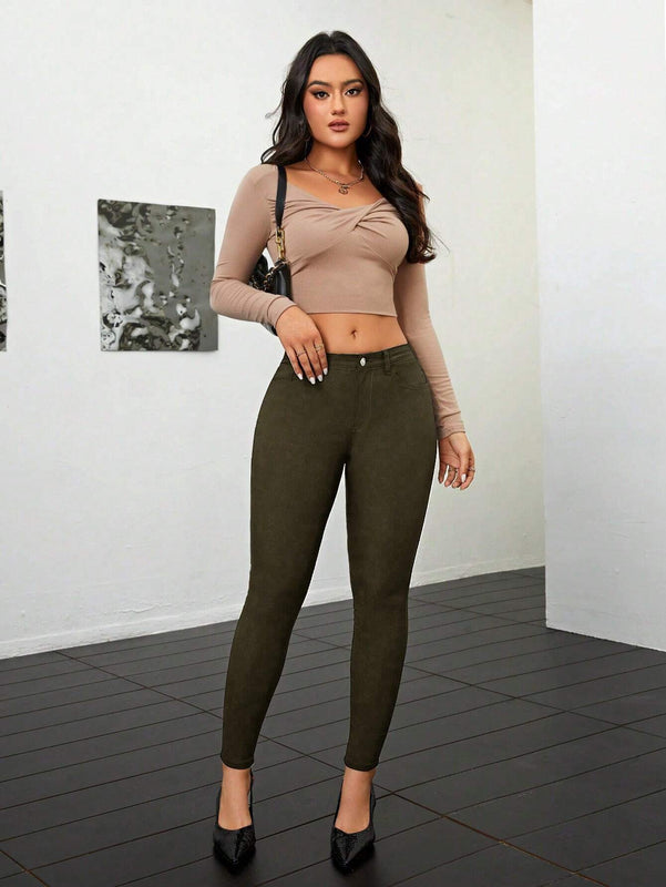 Pantalones ajustados de talle alto y cremallera para mujer de color liso