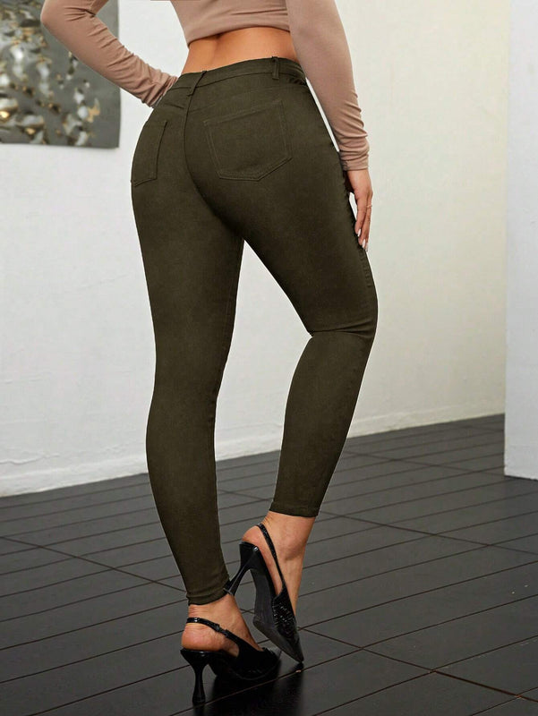 Pantalones ajustados de talle alto y cremallera para mujer de color liso