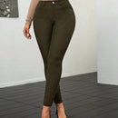 Pantalones ajustados de talle alto y cremallera para mujer de color liso