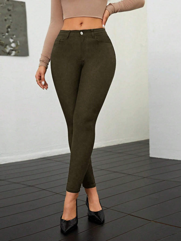 Pantalones ajustados de talle alto y cremallera para mujer de color liso