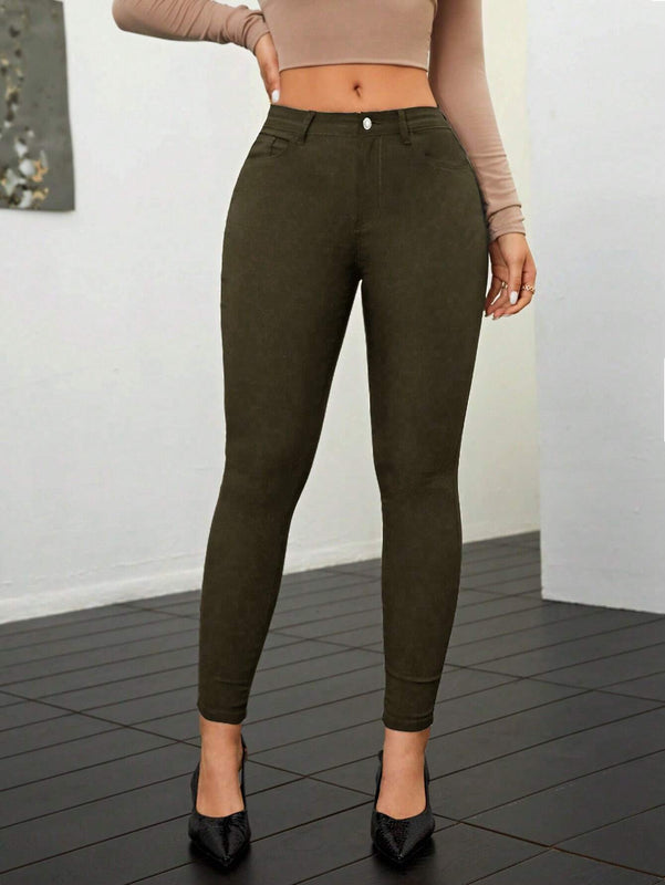 Pantalones ajustados de talle alto y cremallera para mujer de color liso