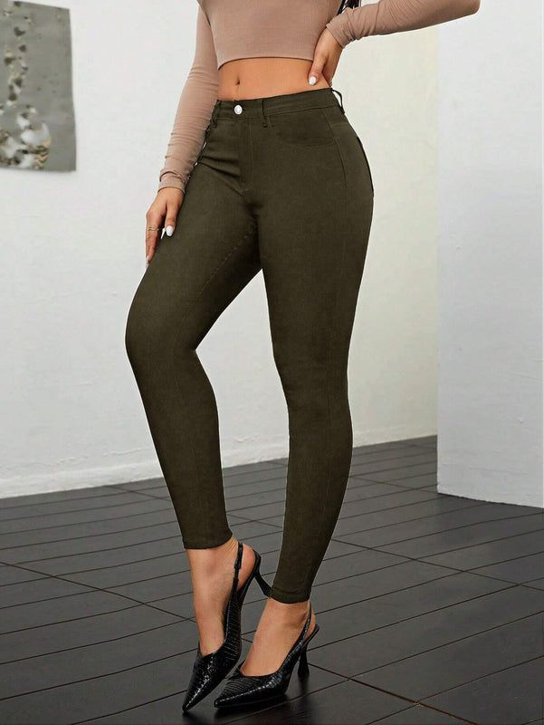 Pantalones ajustados de talle alto y cremallera para mujer de color liso