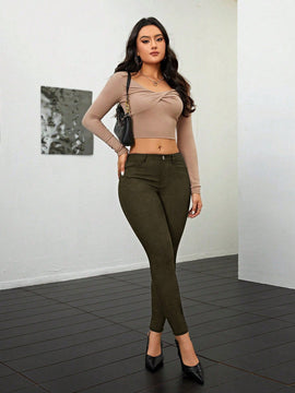Pantalones ajustados de talle alto y cremallera para mujer de color liso