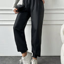 Pantalones largos casuales de cintura elastica con cordon y color solido