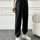 Pantalones largos casuales de cintura elastica con cordon y color solido