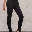 Pantalones ajustados con dobladillo con abertura alta y plisados de color liso para mujer