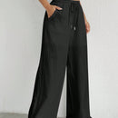 Pantalones sueltos de pierna ancha de color solido para mujer con dobladillo fluido, estilo casual