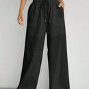 Pantalones sueltos de pierna ancha de color solido para mujer con dobladillo fluido, estilo casual