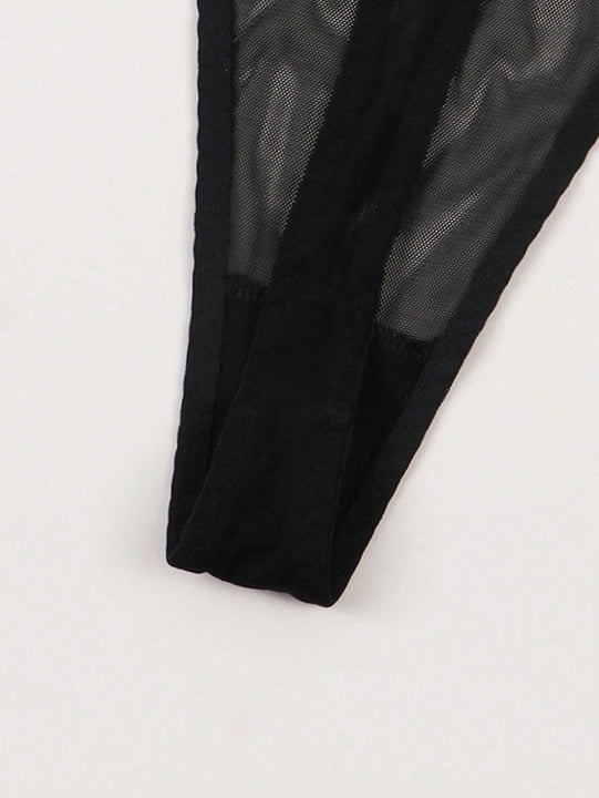 Mujeres sexys tanga de malla transpirable con letras doradas en ingles