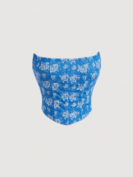 MOD Top corto con corte triangular en forma de banda tejida con patron floral impreso en blanco y azul que moldea la cintura