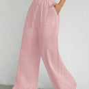 Pantalones sueltos de pierna ancha de color solido para mujer con dobladillo fluido, estilo casual