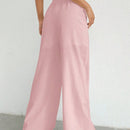 Pantalones sueltos de pierna ancha de color solido para mujer con dobladillo fluido, estilo casual