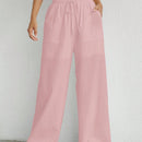 Pantalones sueltos de pierna ancha de color solido para mujer con dobladillo fluido, estilo casual