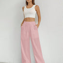Pantalones sueltos de pierna ancha de color solido para mujer con dobladillo fluido, estilo casual
