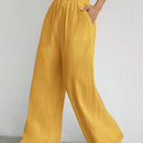 Pantalones sueltos de pierna ancha de color solido para mujer con dobladillo fluido, estilo casual