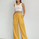 Pantalones sueltos de pierna ancha de color solido para mujer con dobladillo fluido, estilo casual