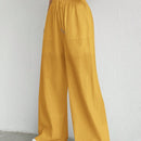 Pantalones sueltos de pierna ancha de color solido para mujer con dobladillo fluido, estilo casual