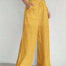 Pantalones sueltos de pierna ancha de color solido para mujer con dobladillo fluido, estilo casual