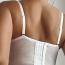Sujetador blanco bordado ajustado con soporte trasero y realce para escote visible a traves de la ropa