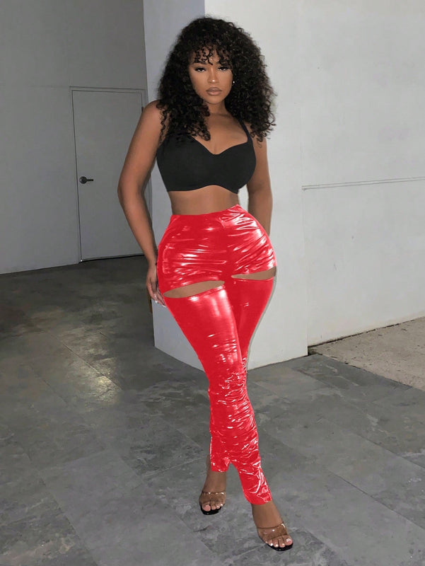 Slayr Leggings sexys y reflectantes con cintura alta, corte estilizado y ajustado con diseno de recortes en la cadera para un look atractivo y moderno.