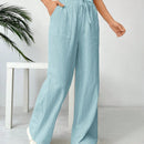 Pantalones sueltos de pierna ancha de color solido para mujer con dobladillo fluido, estilo casual