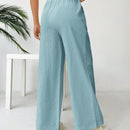 Pantalones sueltos de pierna ancha de color solido para mujer con dobladillo fluido, estilo casual