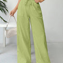 Pantalones sueltos de pierna ancha de color solido para mujer con dobladillo fluido, estilo casual