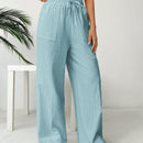 Pantalones sueltos de pierna ancha de color solido para mujer con dobladillo fluido, estilo casual