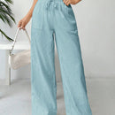 Pantalones sueltos de pierna ancha de color solido para mujer con dobladillo fluido, estilo casual