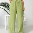 Pantalones sueltos de pierna ancha de color solido para mujer con dobladillo fluido, estilo casual