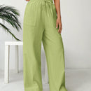 Pantalones sueltos de pierna ancha de color solido para mujer con dobladillo fluido, estilo casual