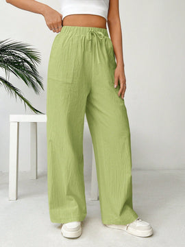 Pantalones sueltos de pierna ancha de color solido para mujer con dobladillo fluido, estilo casual