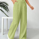 Pantalones sueltos de pierna ancha de color solido para mujer con dobladillo fluido, estilo casual