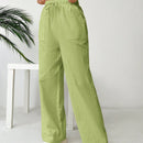 Pantalones sueltos de pierna ancha de color solido para mujer con dobladillo fluido, estilo casual