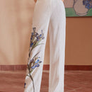 Motf premium pantalones de bolsillo inclinado con estampado floral y costura frontal