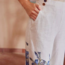 Motf premium pantalones de bolsillo inclinado con estampado floral y costura frontal