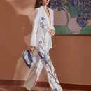 Motf premium pantalones de bolsillo inclinado con estampado floral y costura frontal