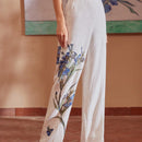 Motf premium pantalones de bolsillo inclinado con estampado floral y costura frontal