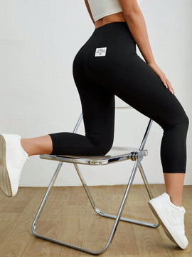 PETITE Mallas negras informales y elasticas para mujeres con detalles de etiqueta en la parte trasera