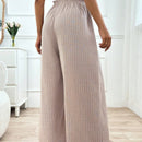 Pantalones boho anchos de vacaciones con bandas elasticas tejidas de rayas y cordon decorativo