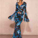 Top de mujer de festival de primavera con malla transparente con patron floral, mangas acampanadas con volantes y tiras cruzadas ajustadas y elasticas
