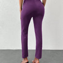 Pantalones unicolor bajo con abertura con cinturon