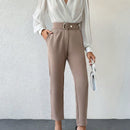 Pantalones zanahoria con bolsillo oblicuo liso