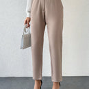 Pantalones zanahoria con bolsillo oblicuo liso